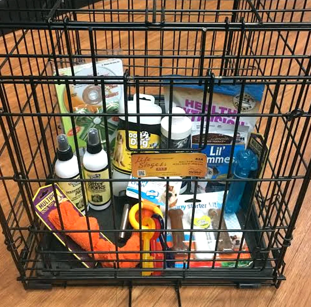 The Petland Overland Park puppy package: crate, food, supplements, toys and grooming supplies ready to go home